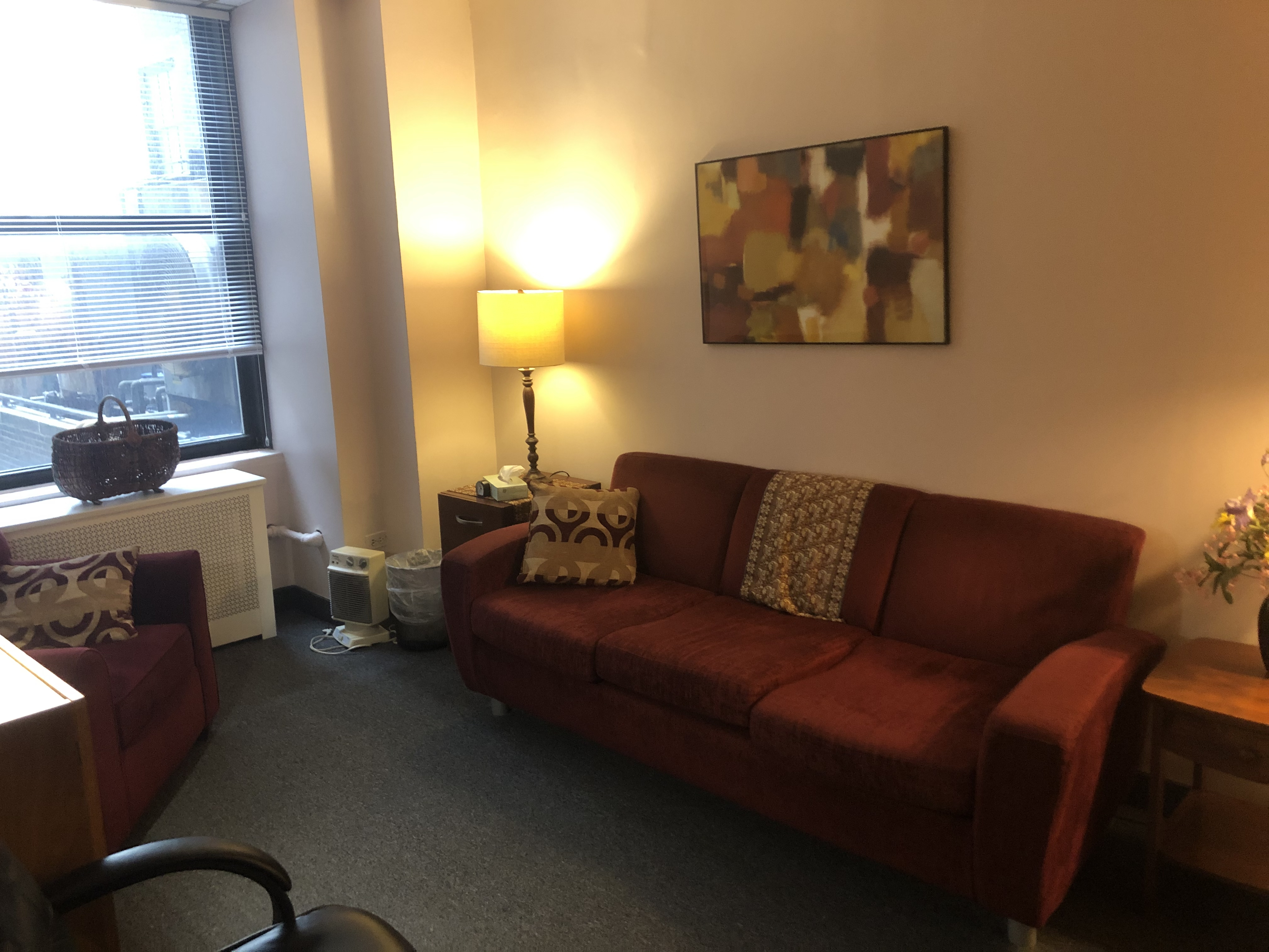 Office space with desks, chairs, and bookshelves