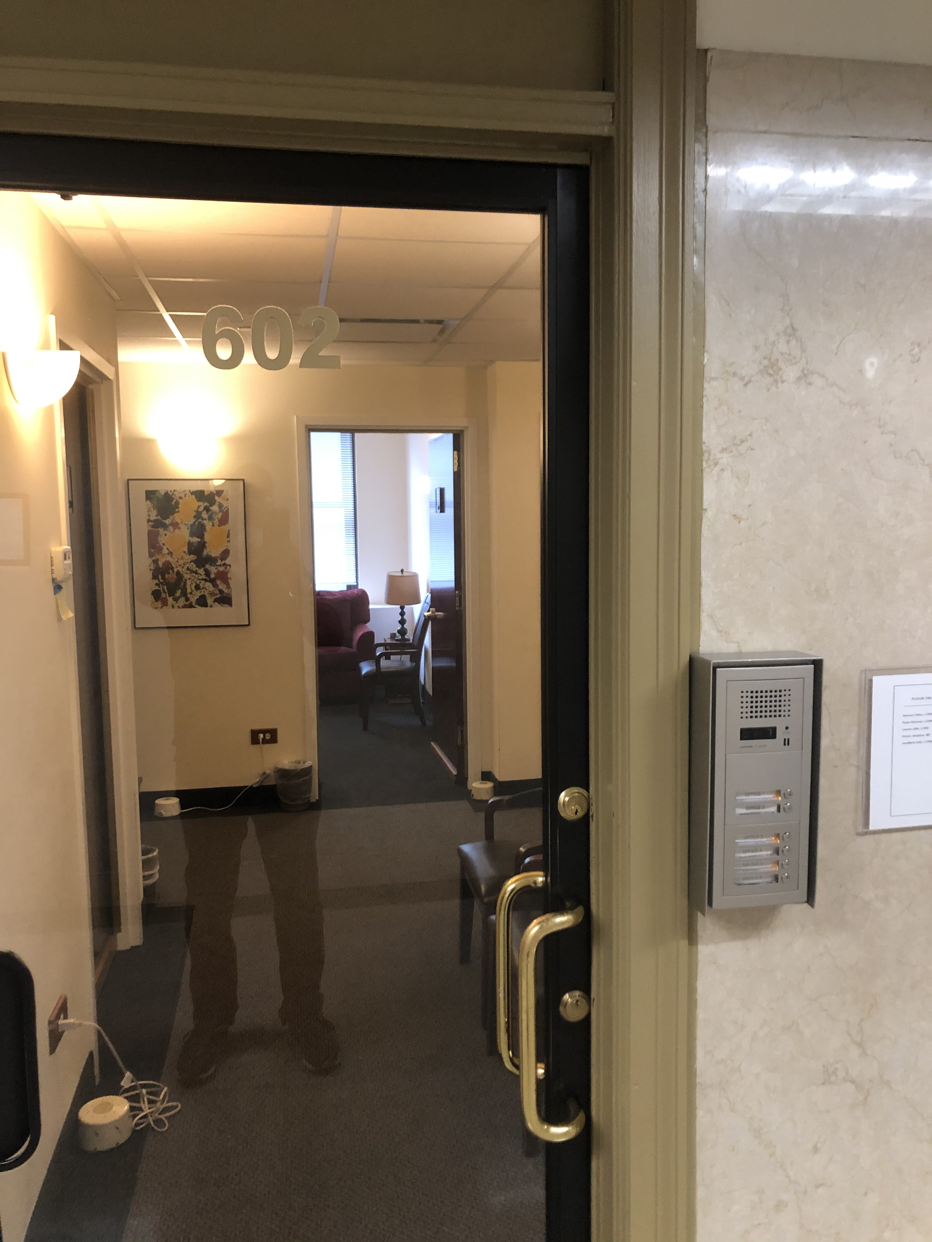 Professional office space with large windows and light colors