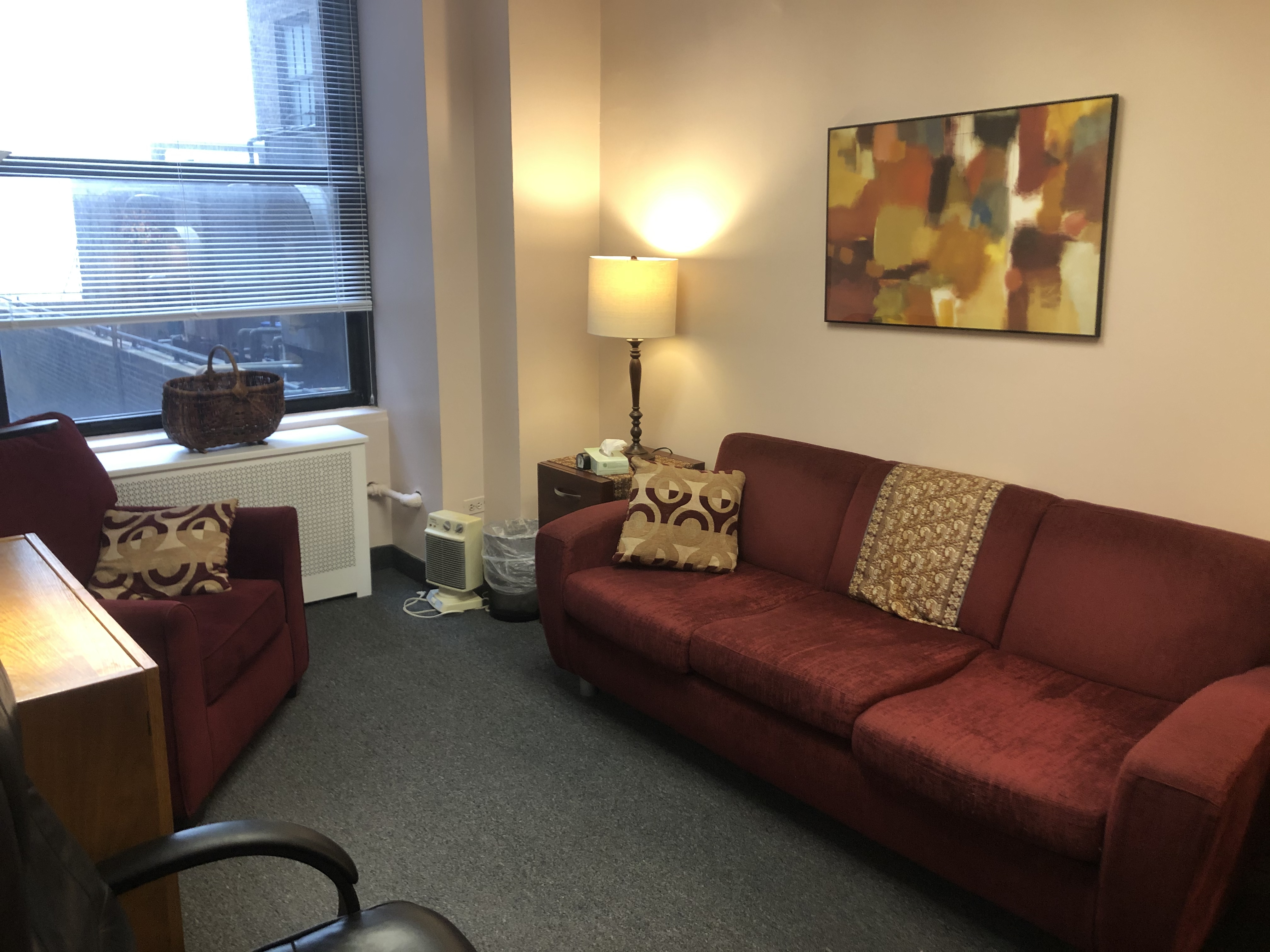 Office reception area with seating and desk