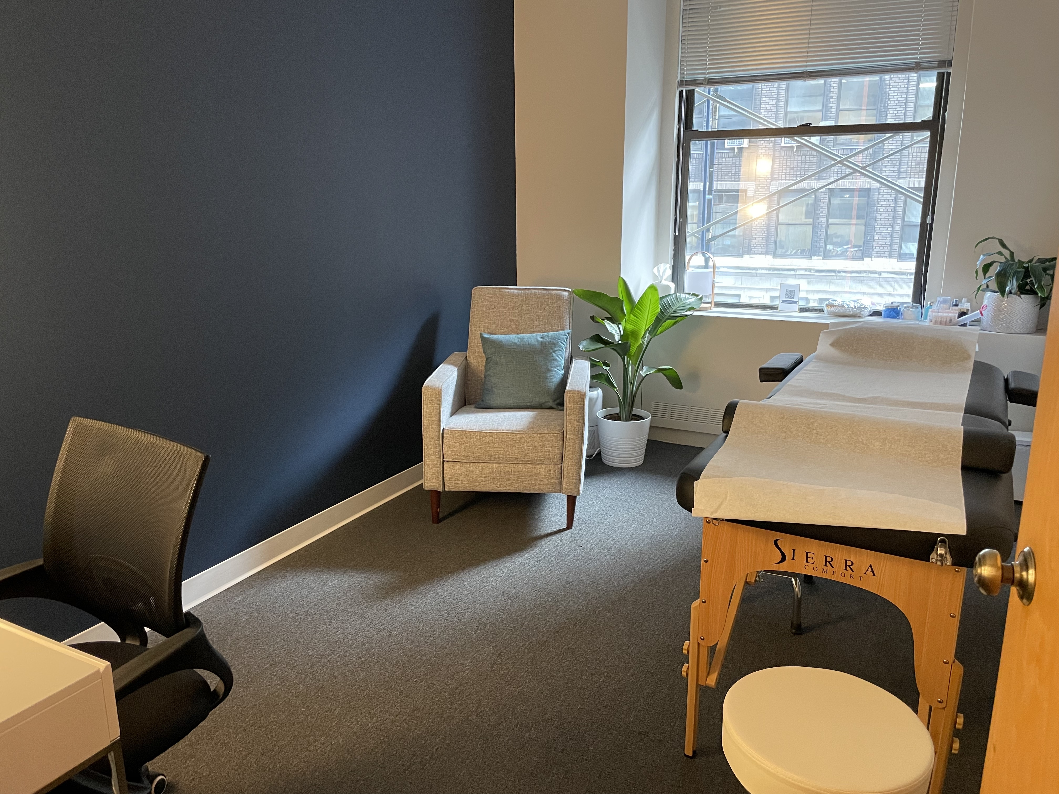 Simple office room with desk and bookcase