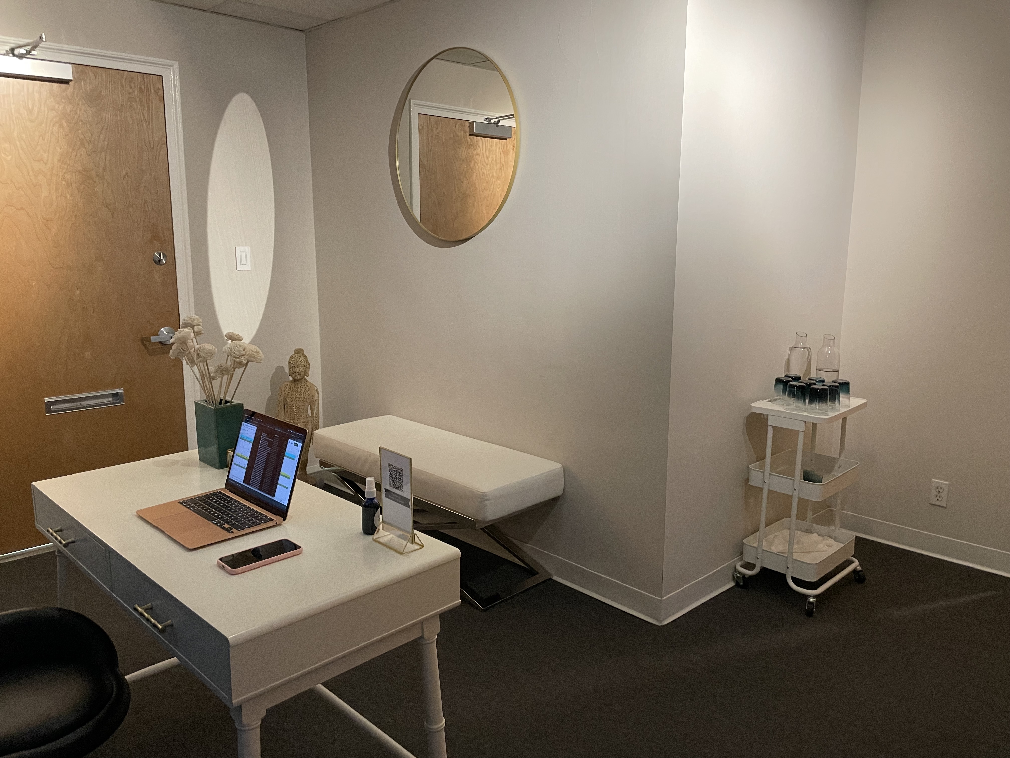 Spacious office with large windows and desk setup