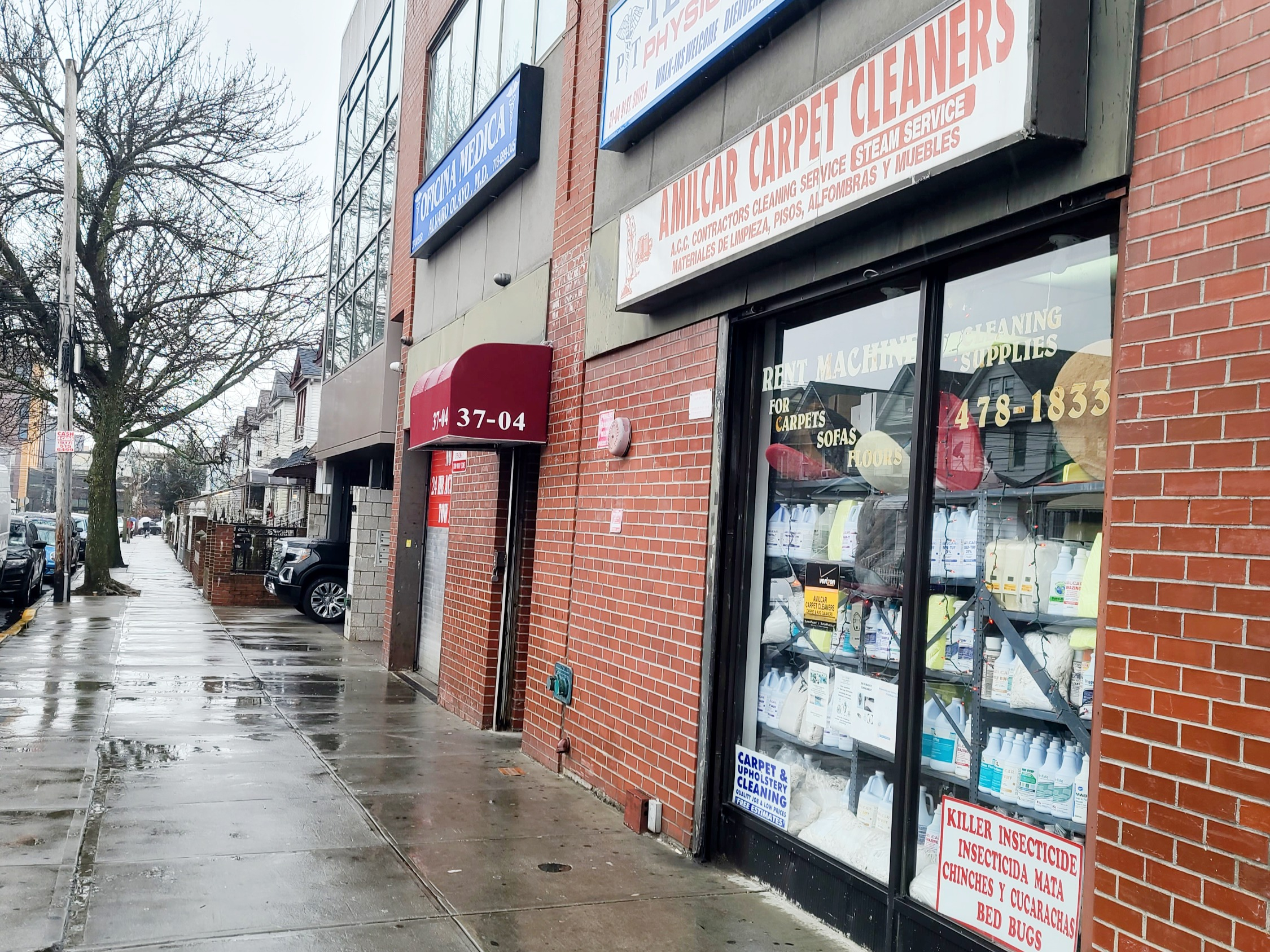 Urban office building with sidewalk and nearby shops
