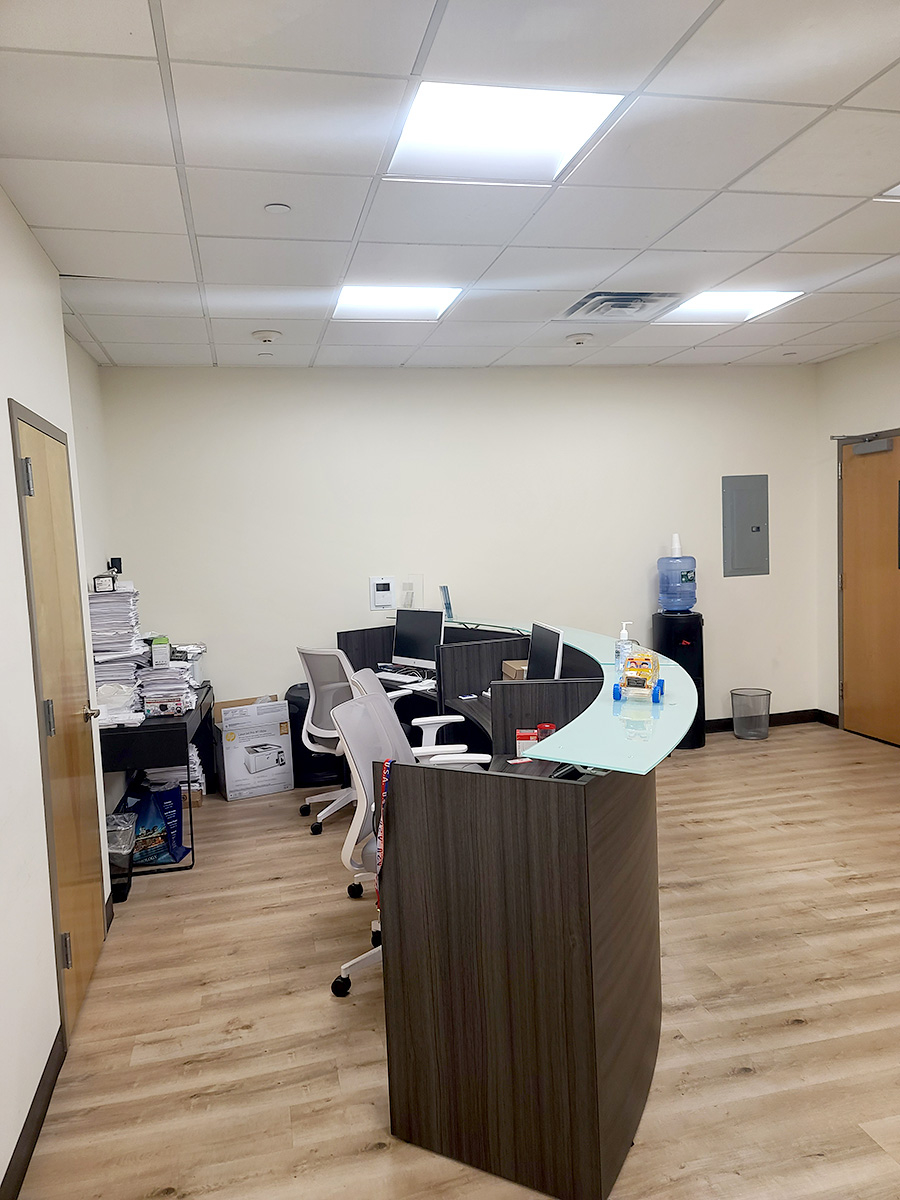 Well-designed office with table, chairs, and monitor setup