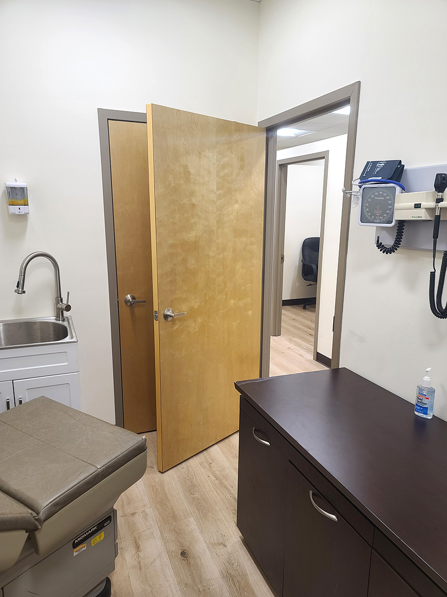 Office interior featuring a wooden door and decorative lighting