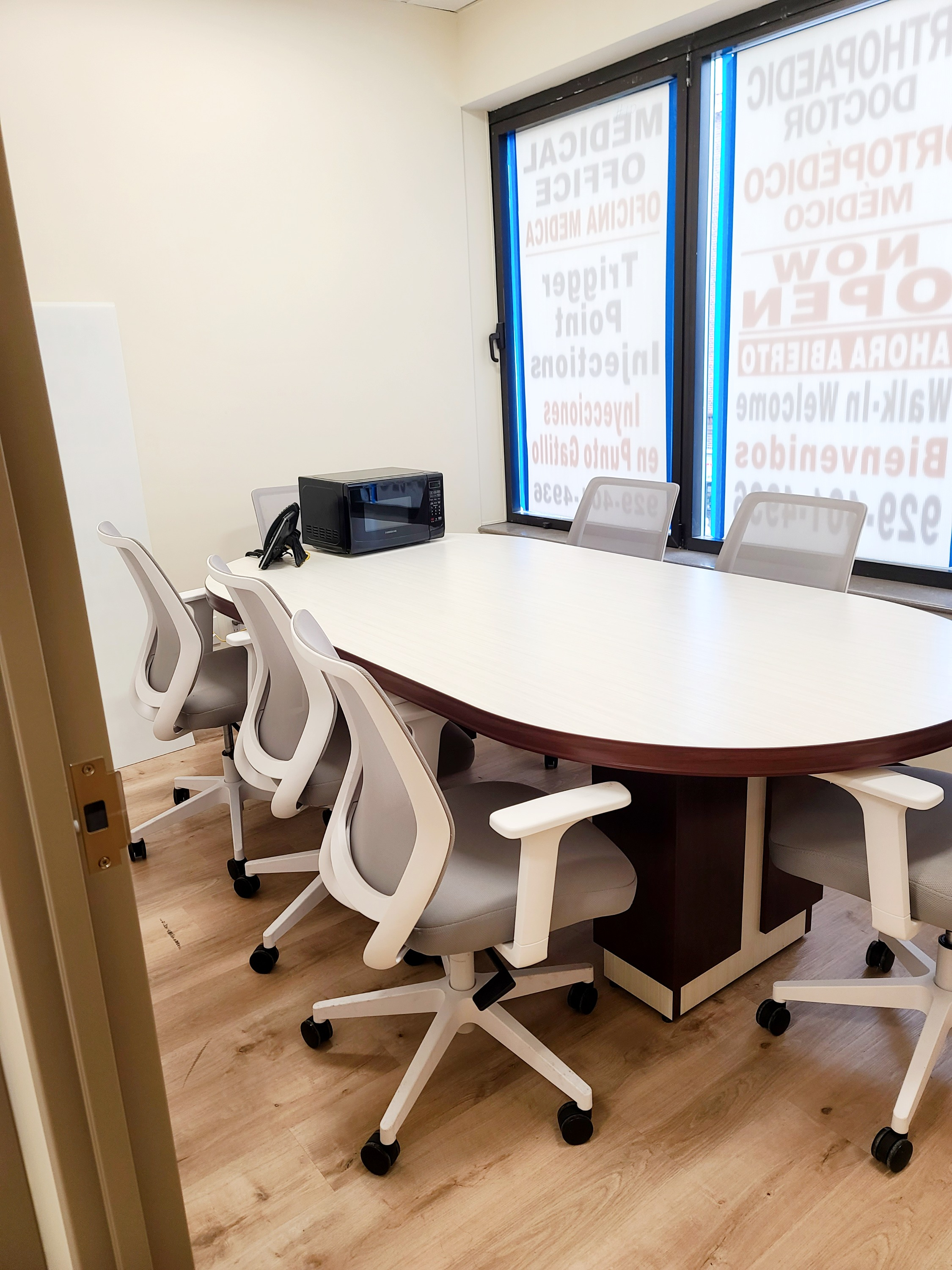 Office meeting room with a table and chairs