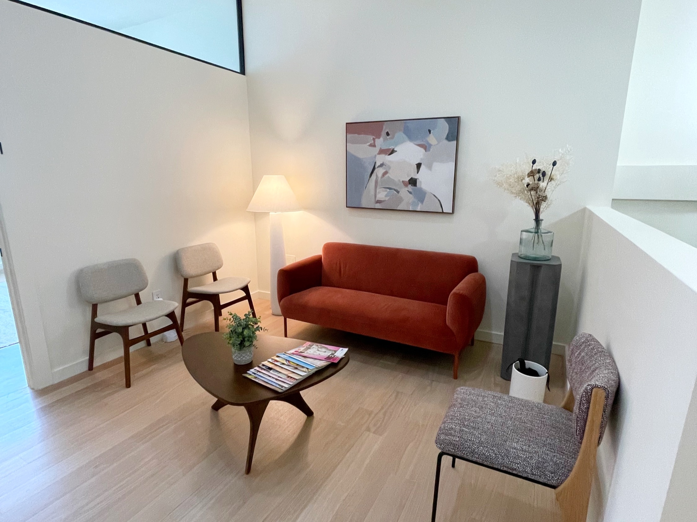 Bright living room-style office with comfortable furniture