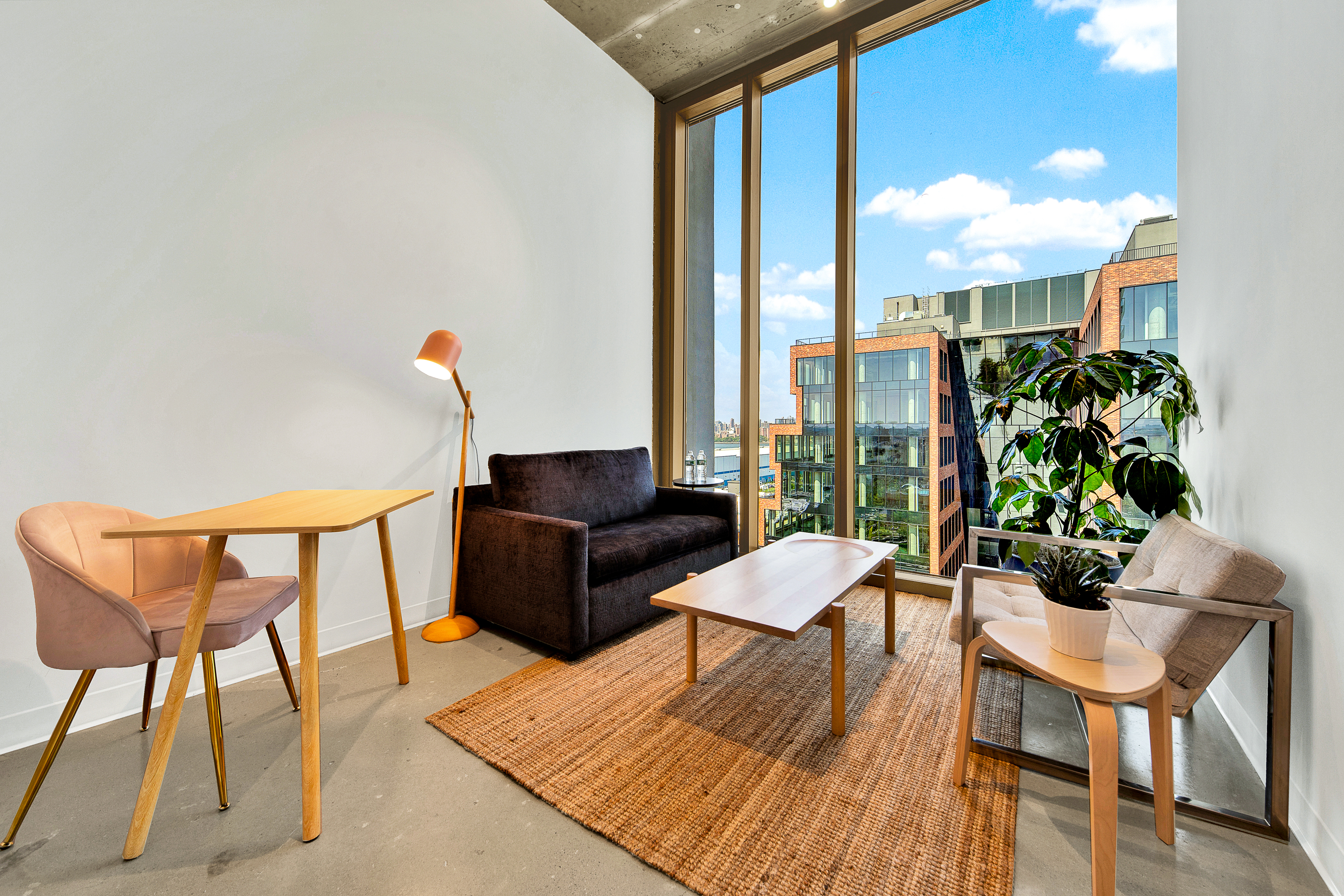 Bright office space with large windows and minimalist decor