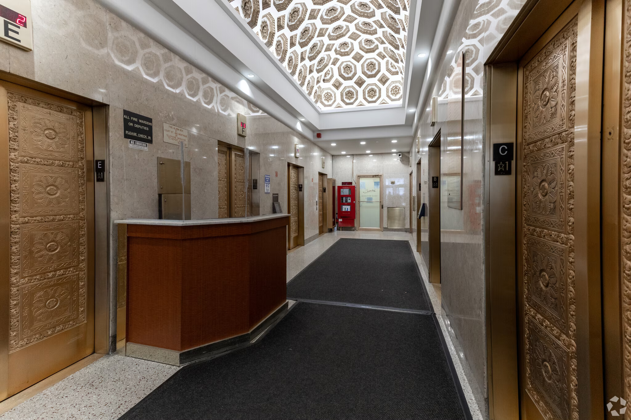 Bright corridor with rug and decorative elements