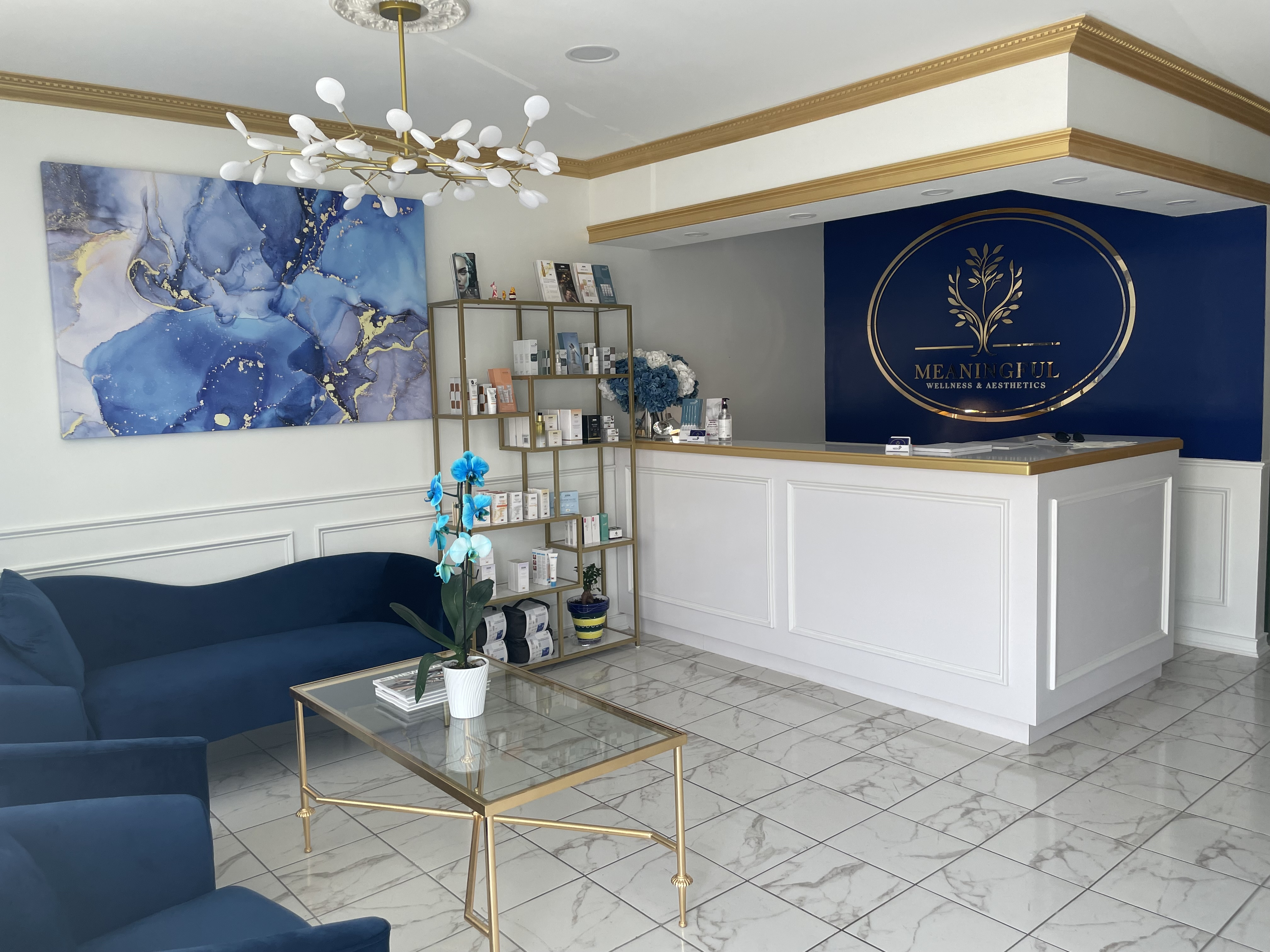 Bright foyer with plants and a chandelier