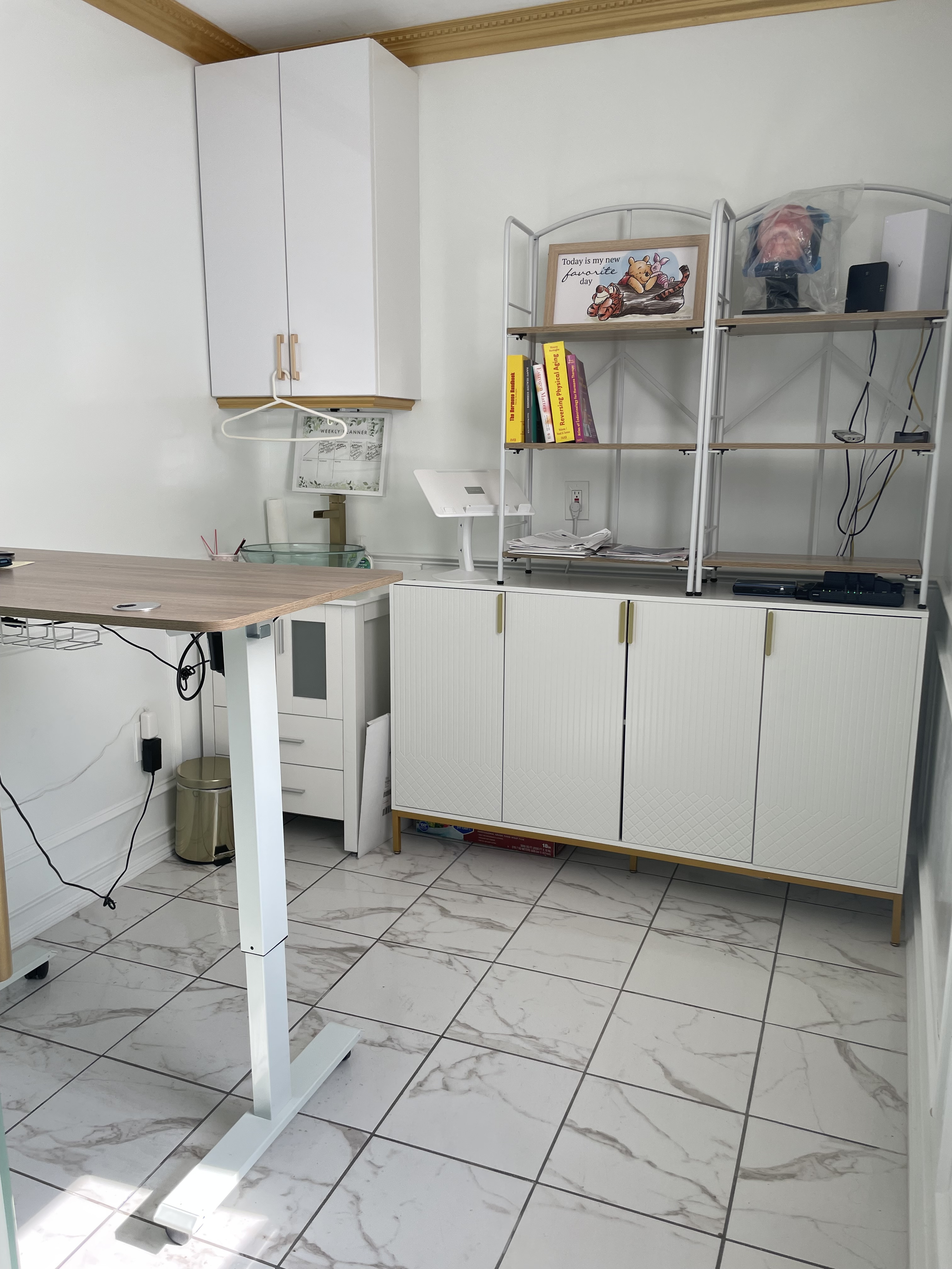 Office space featuring desk, chairs, and electronics