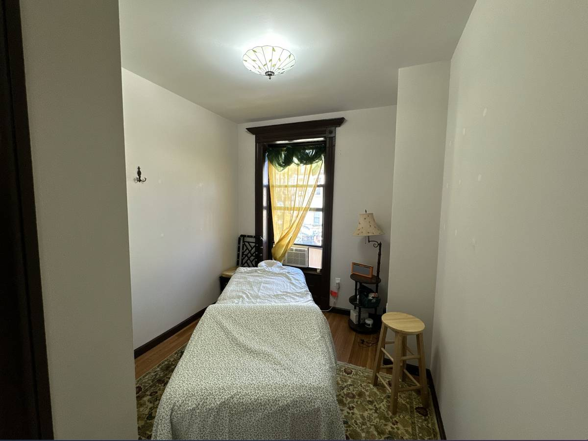 Spa area featuring furniture and a bed for relaxation