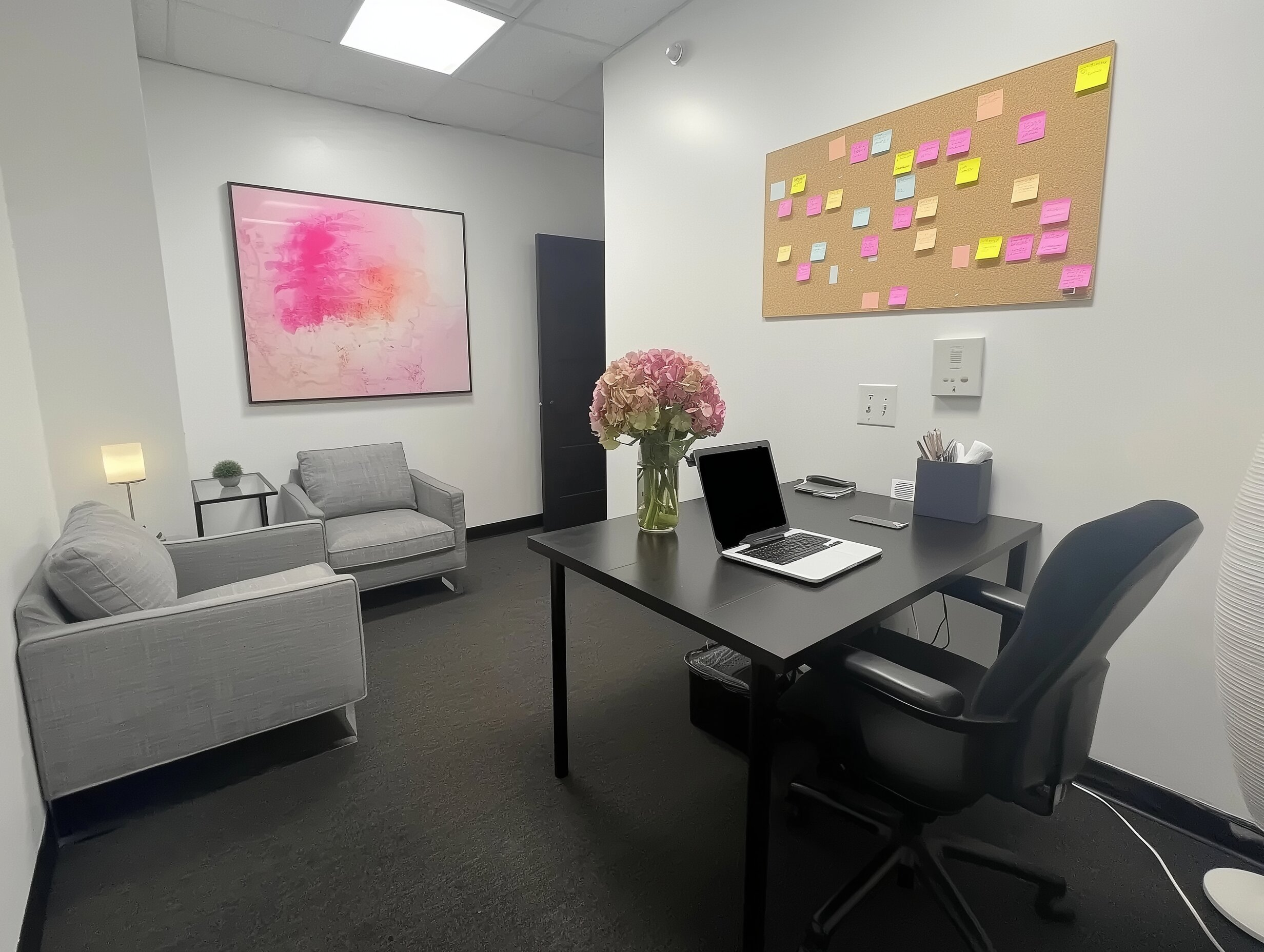 Well-designed office interior with desk, chair, and lamp