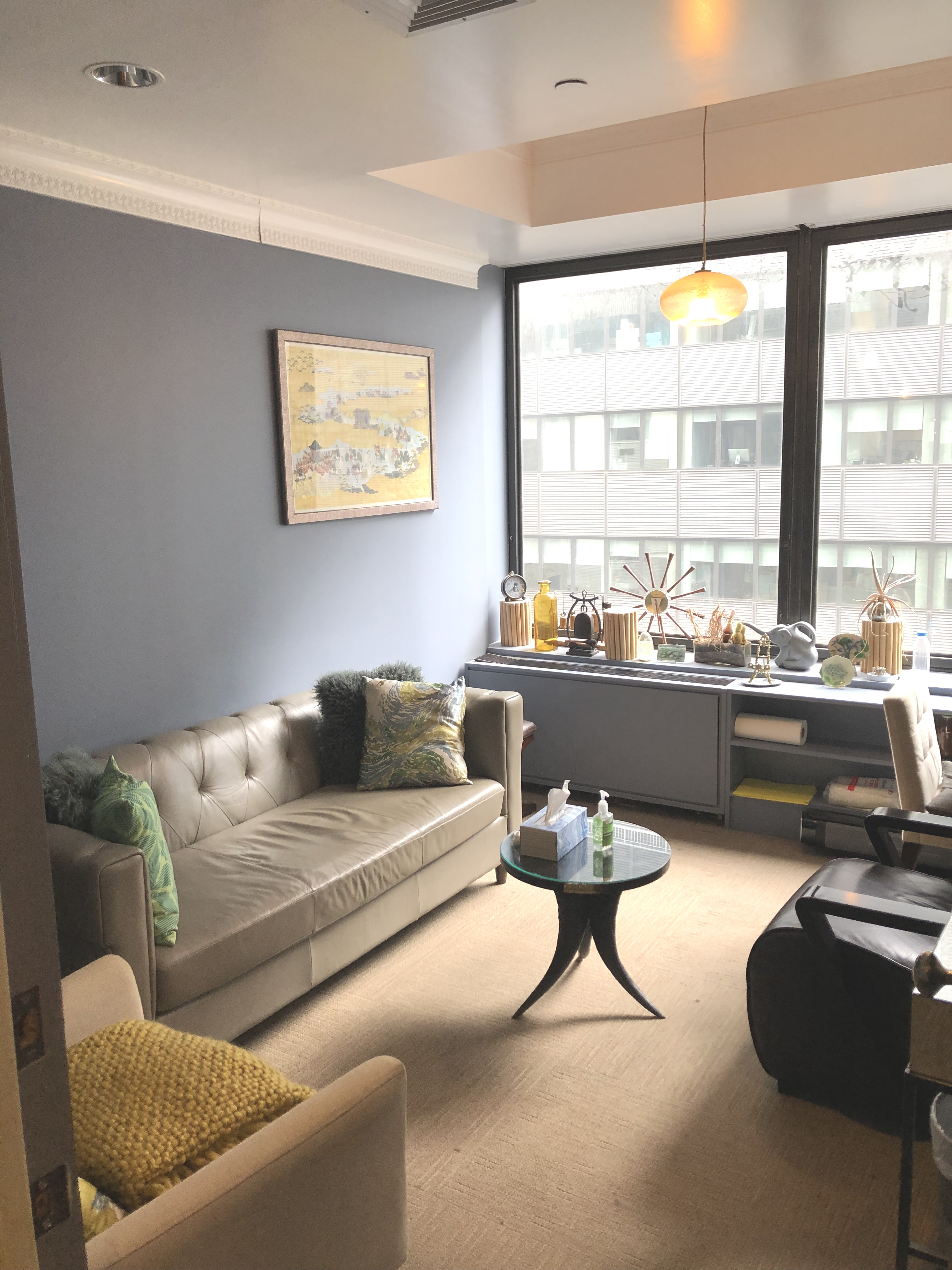 Living room with couch, coffee table, and lamp