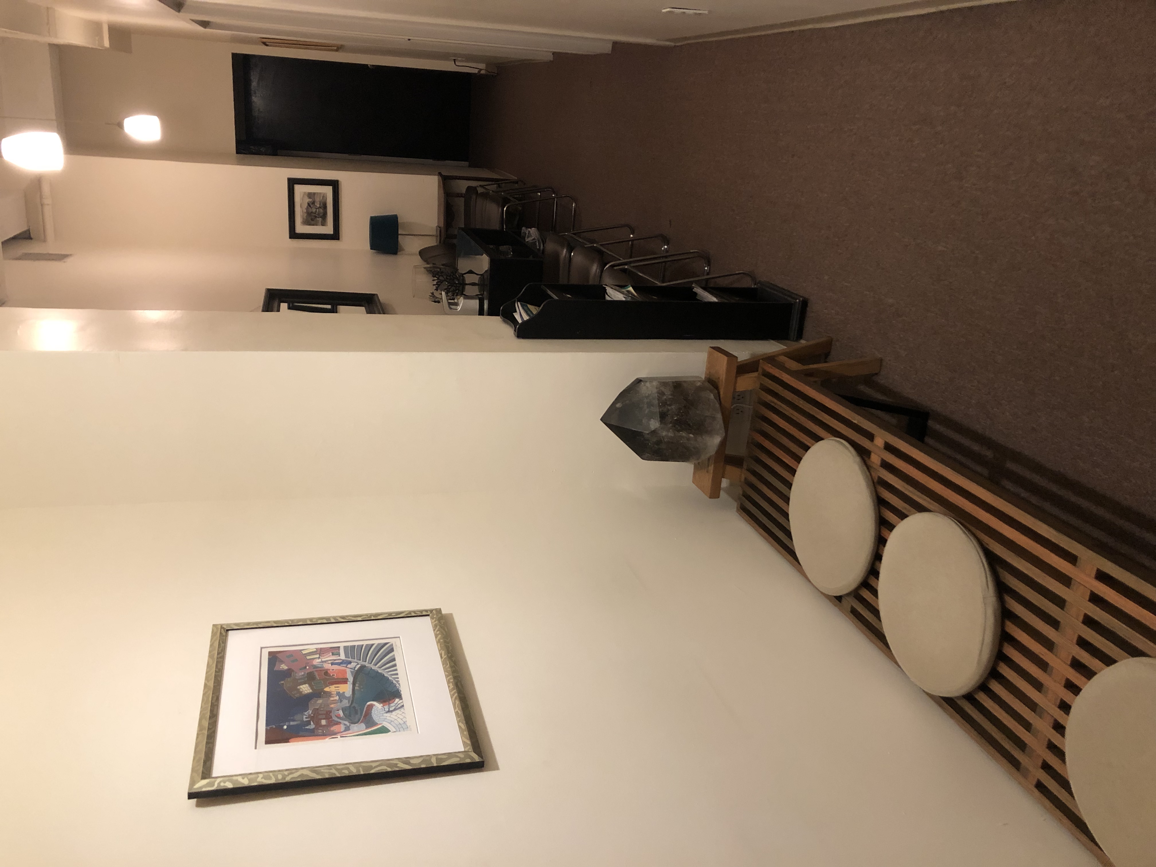 Waiting room with lamp, art, and decorative plate