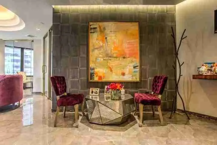 Spacious office foyer with art and modern furniture