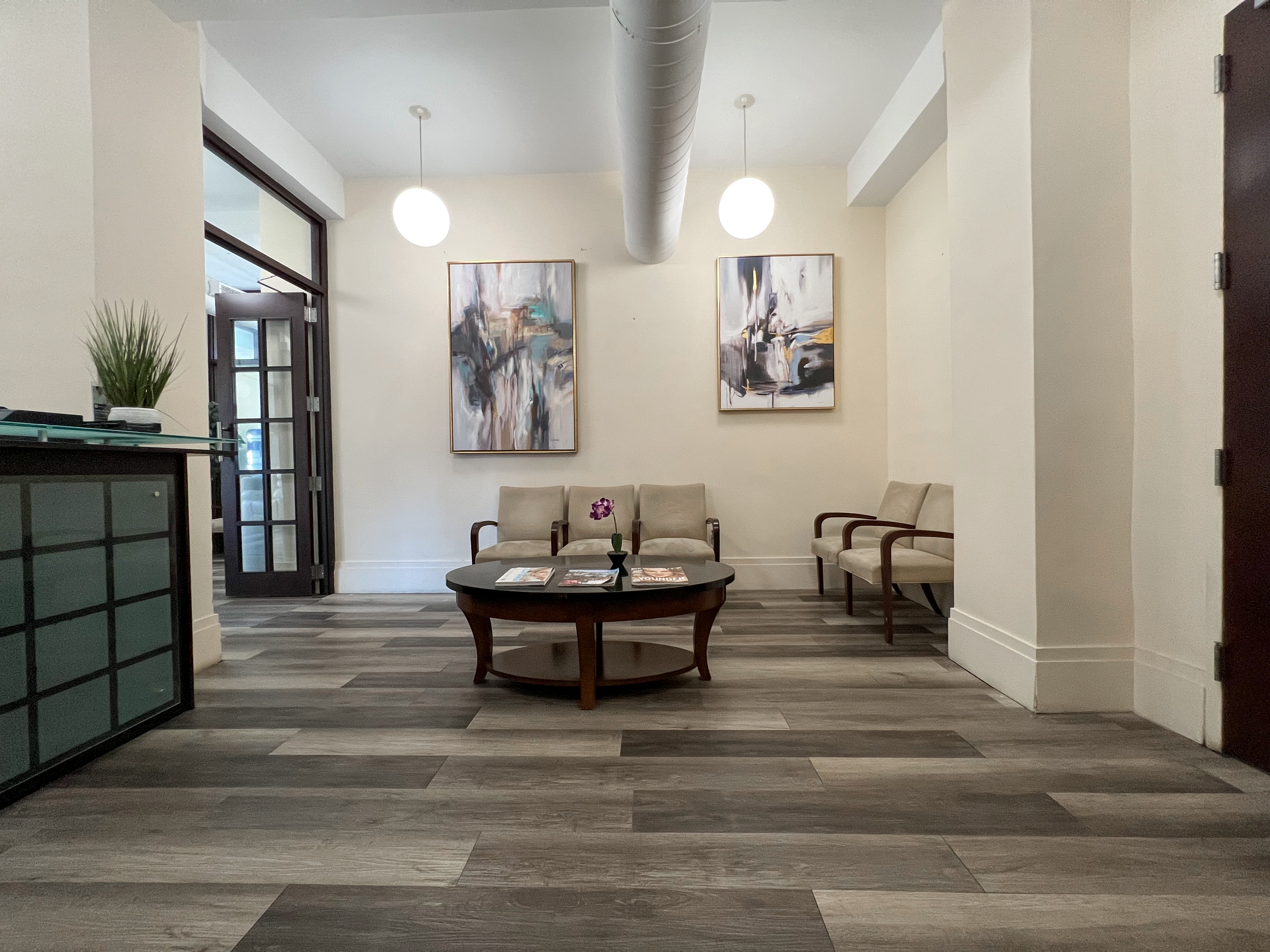 Bright office room with chairs and desk arrangement