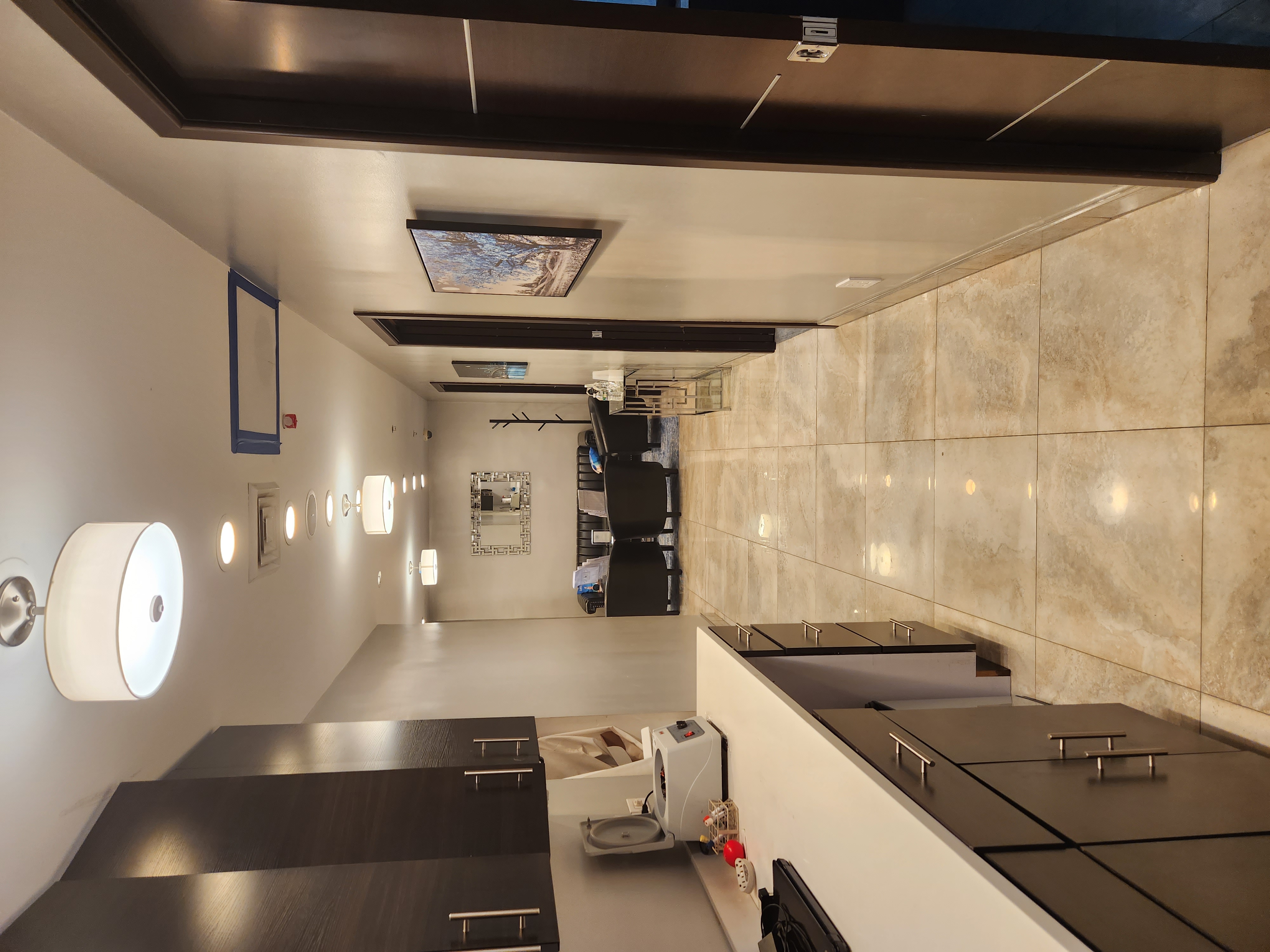 Interior floor space featuring modern flooring and a lamp