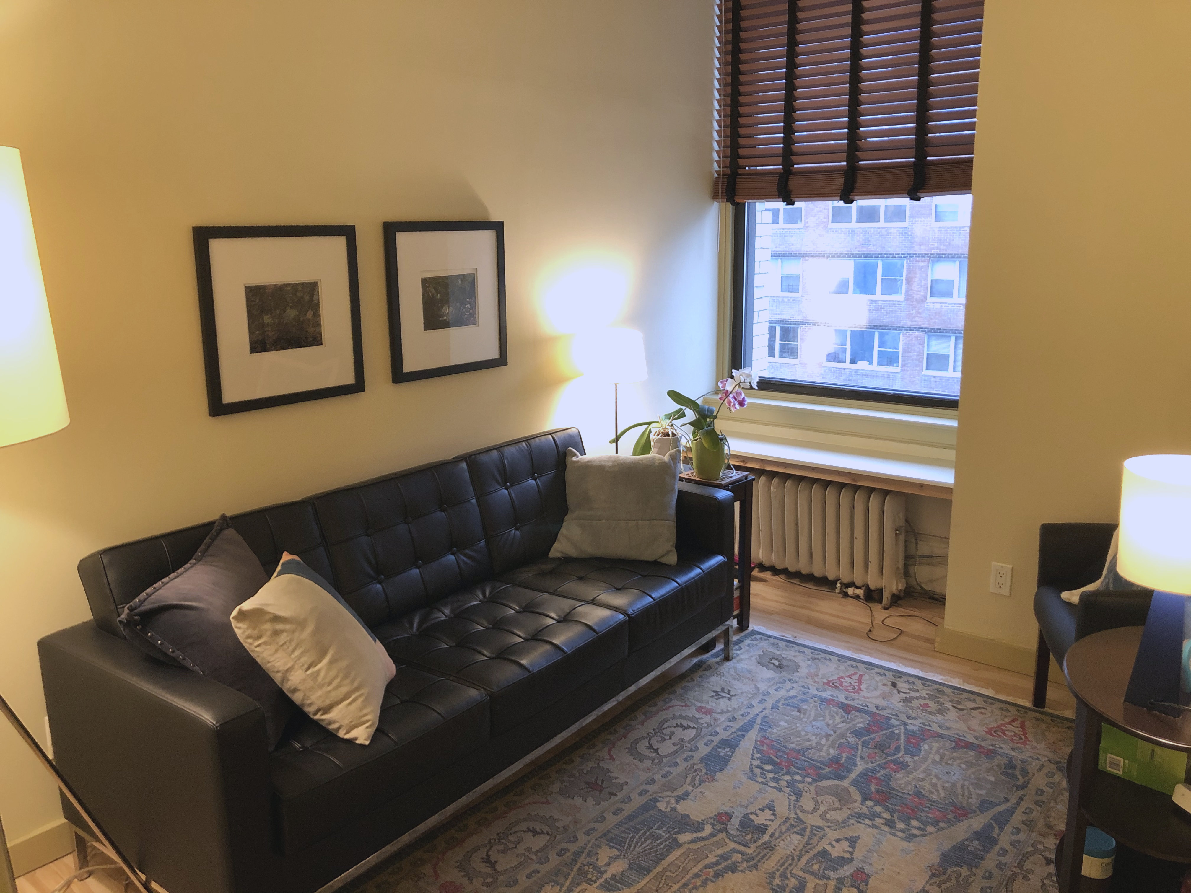 Cozy office living room with couch and lamps