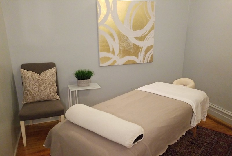 Office space featuring a chair, plants, and decorative elements