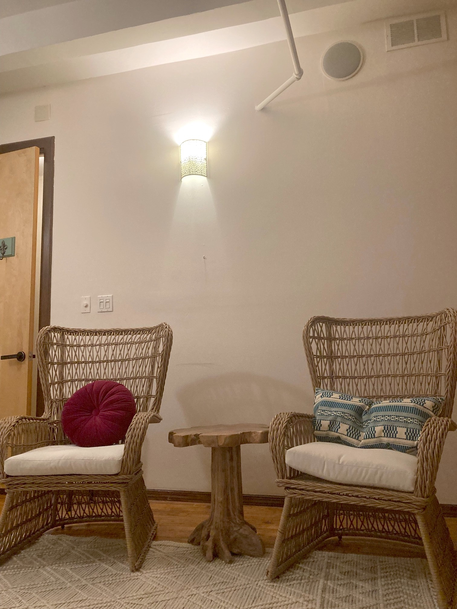 Living room setup with armchair and decorative cushions