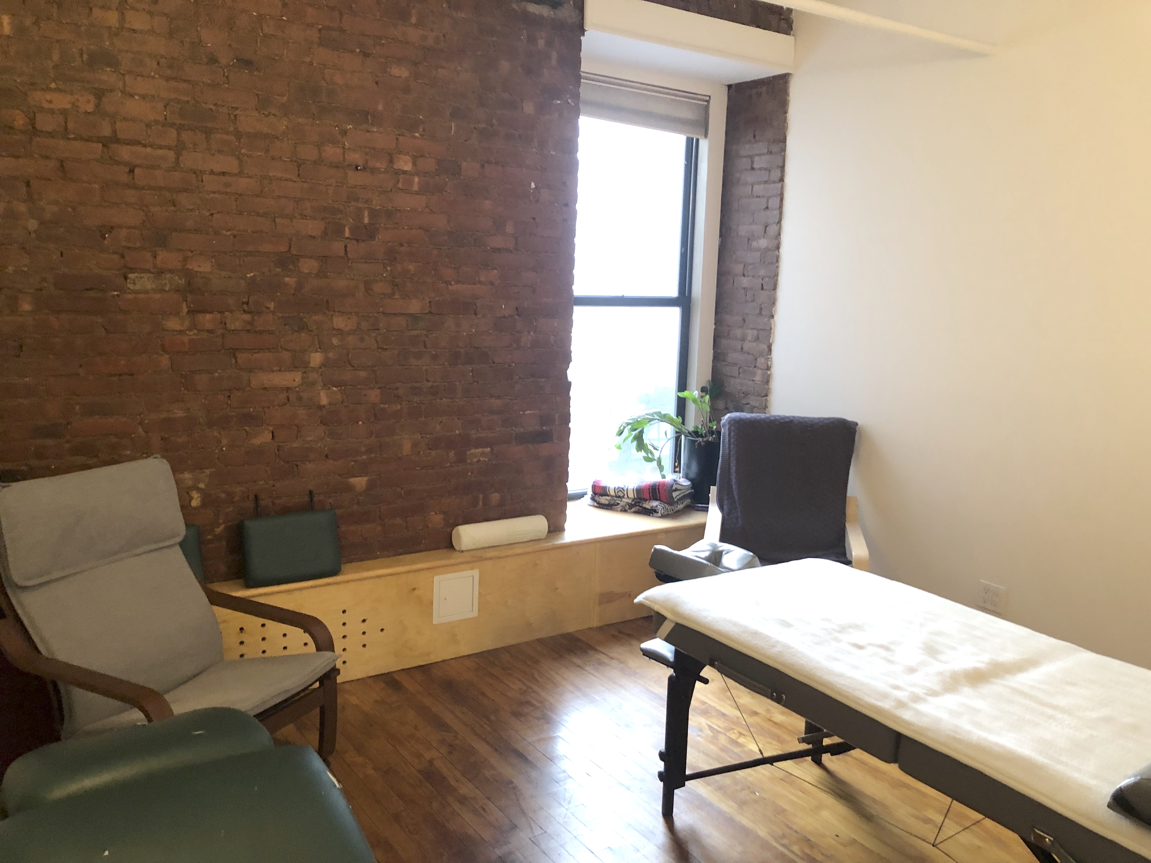 Professional office space with large windows and workstations