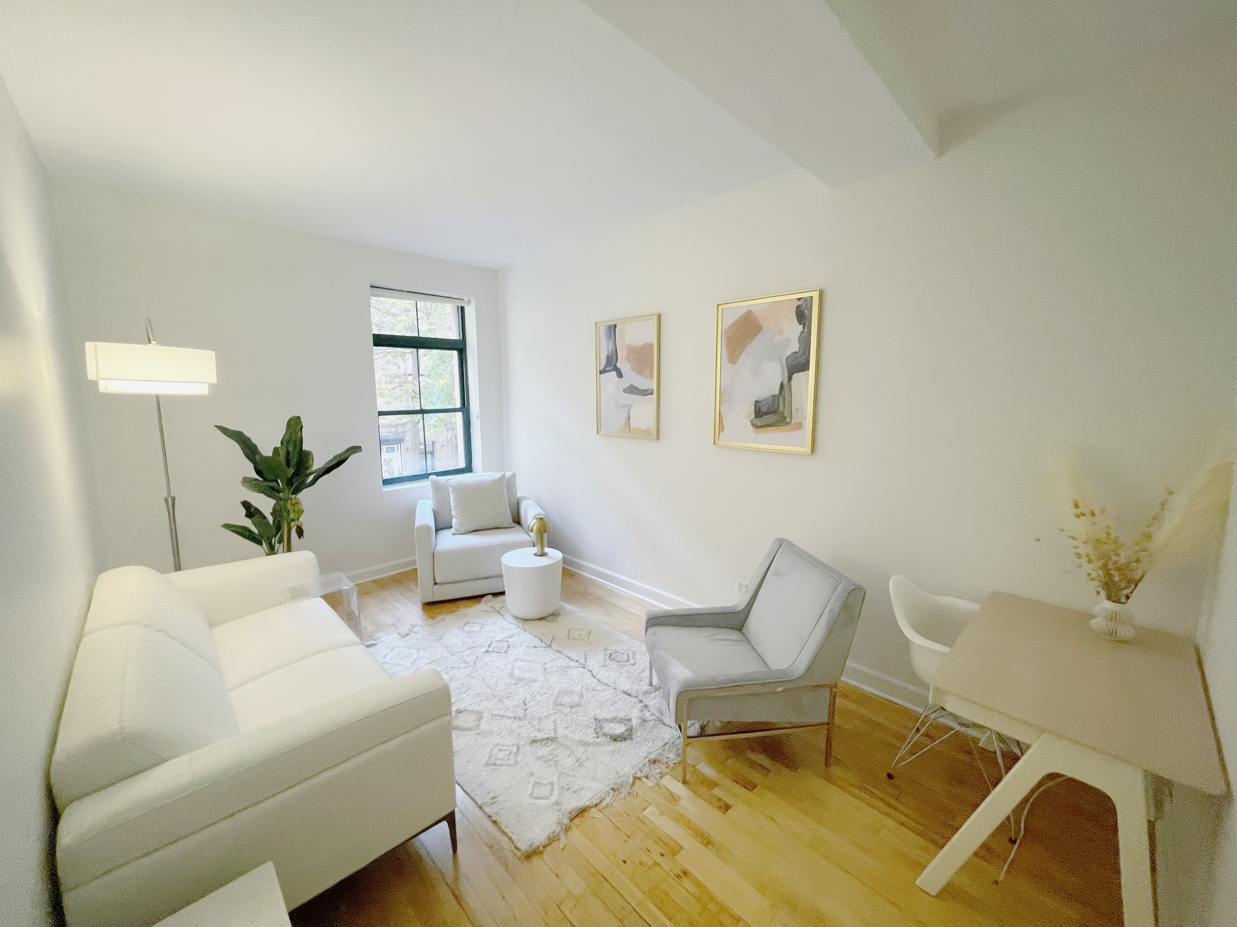 Bright office space featuring desks and chairs