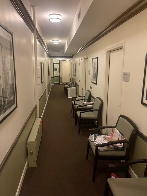 Interior office space featuring a chair and lamp