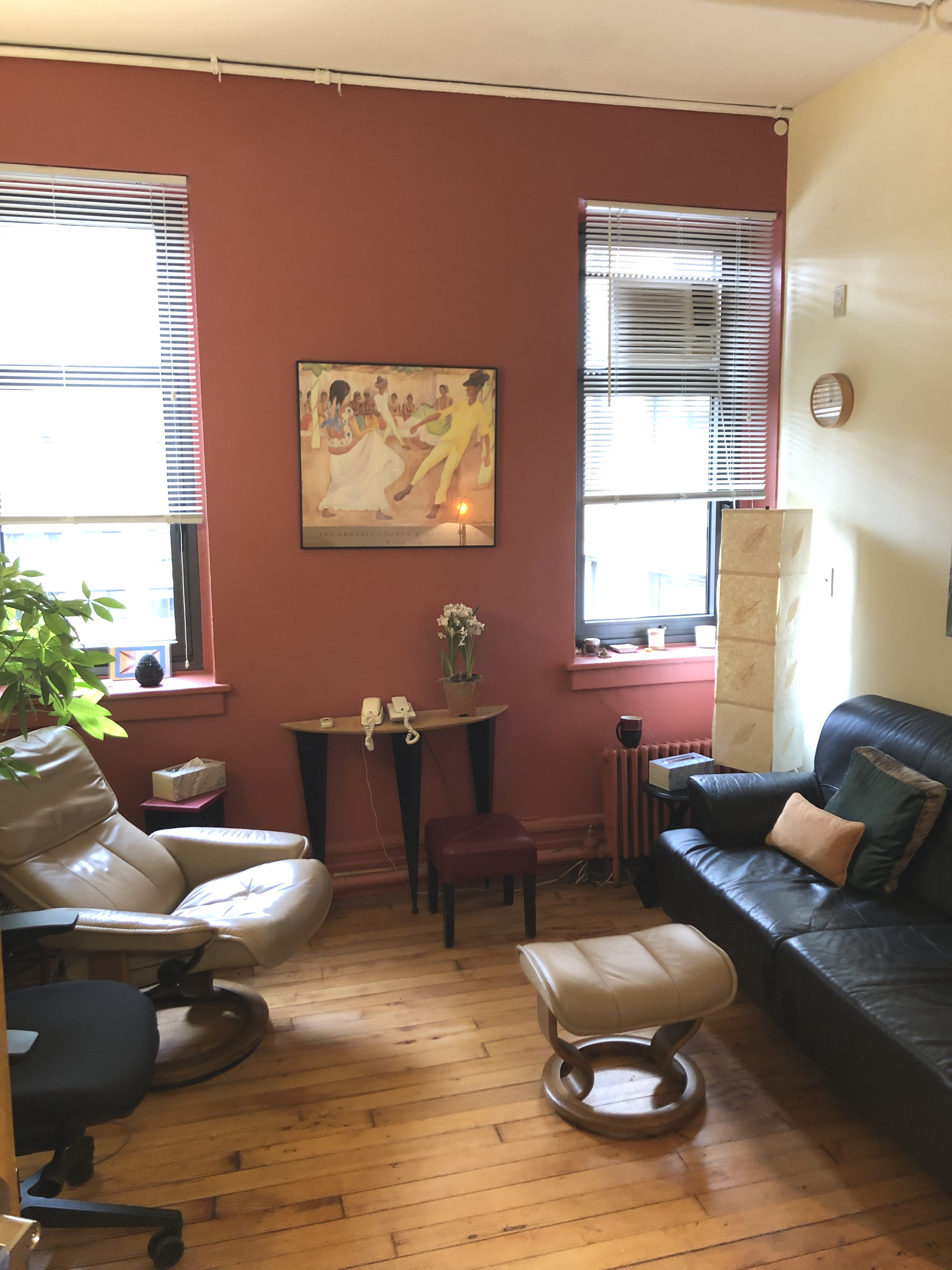 Interior office space with furniture and hardwood flooring