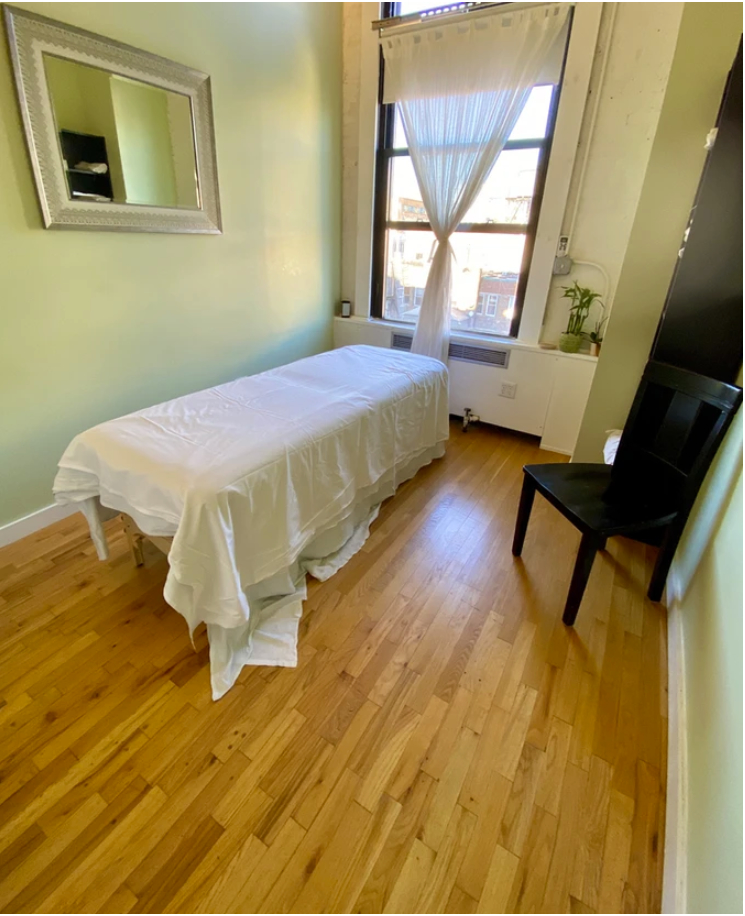 Office interior with hardwood flooring and seating area