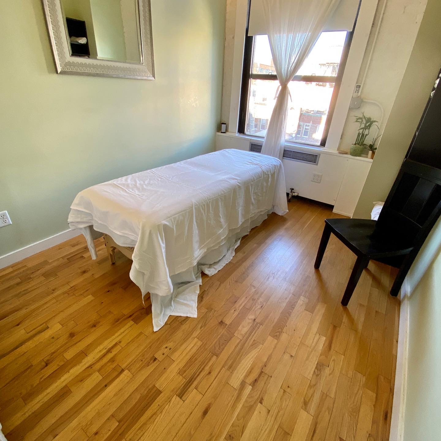 Interior office with hardwood floor and stained wood furniture