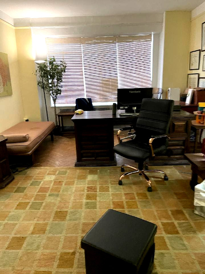 Office space featuring desk, chairs, and modern decor