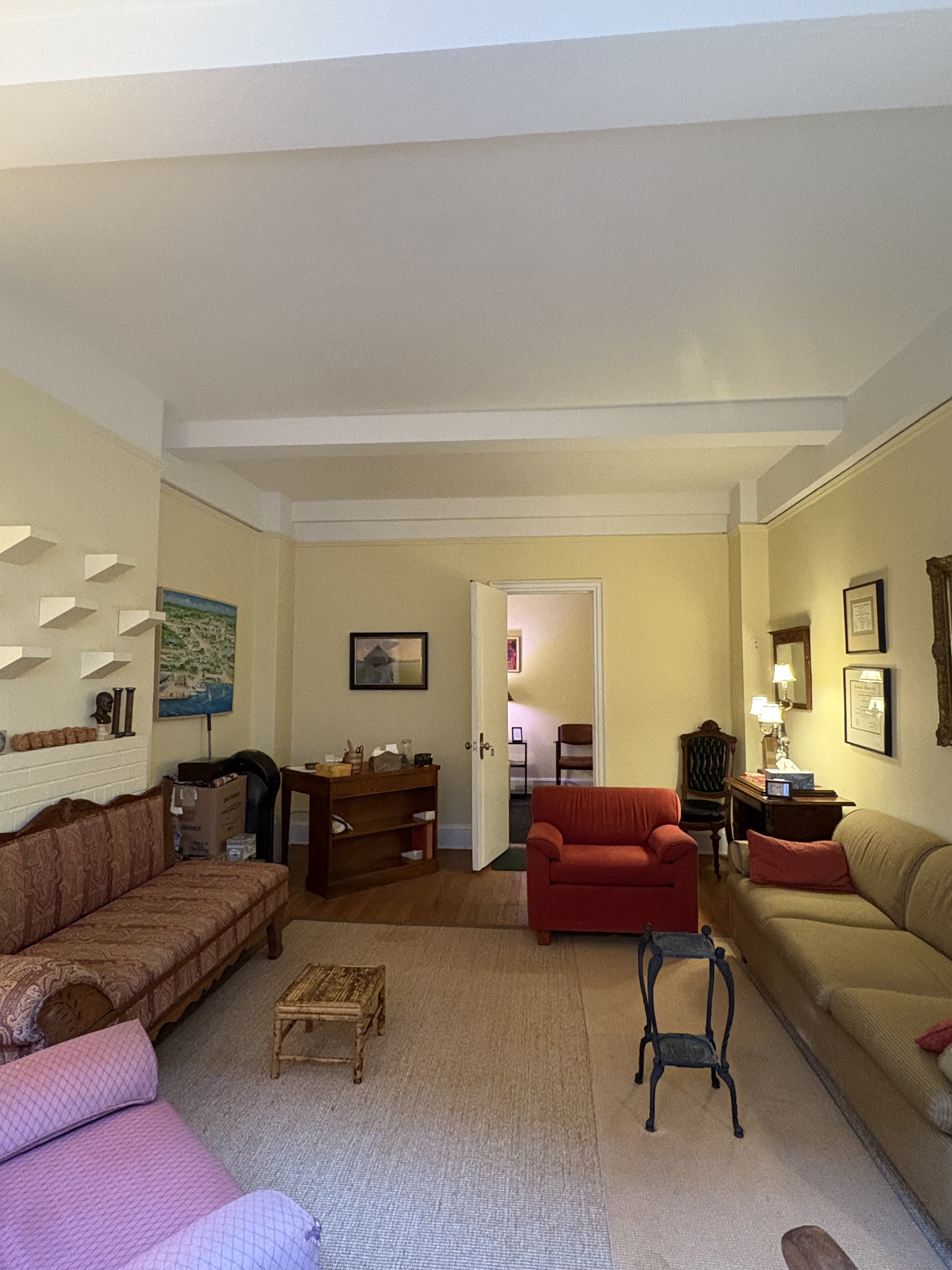 Cozy office living room with couch and armchair furniture