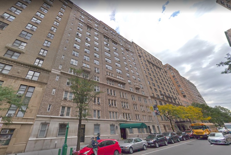 High rise building with street view and parked cars