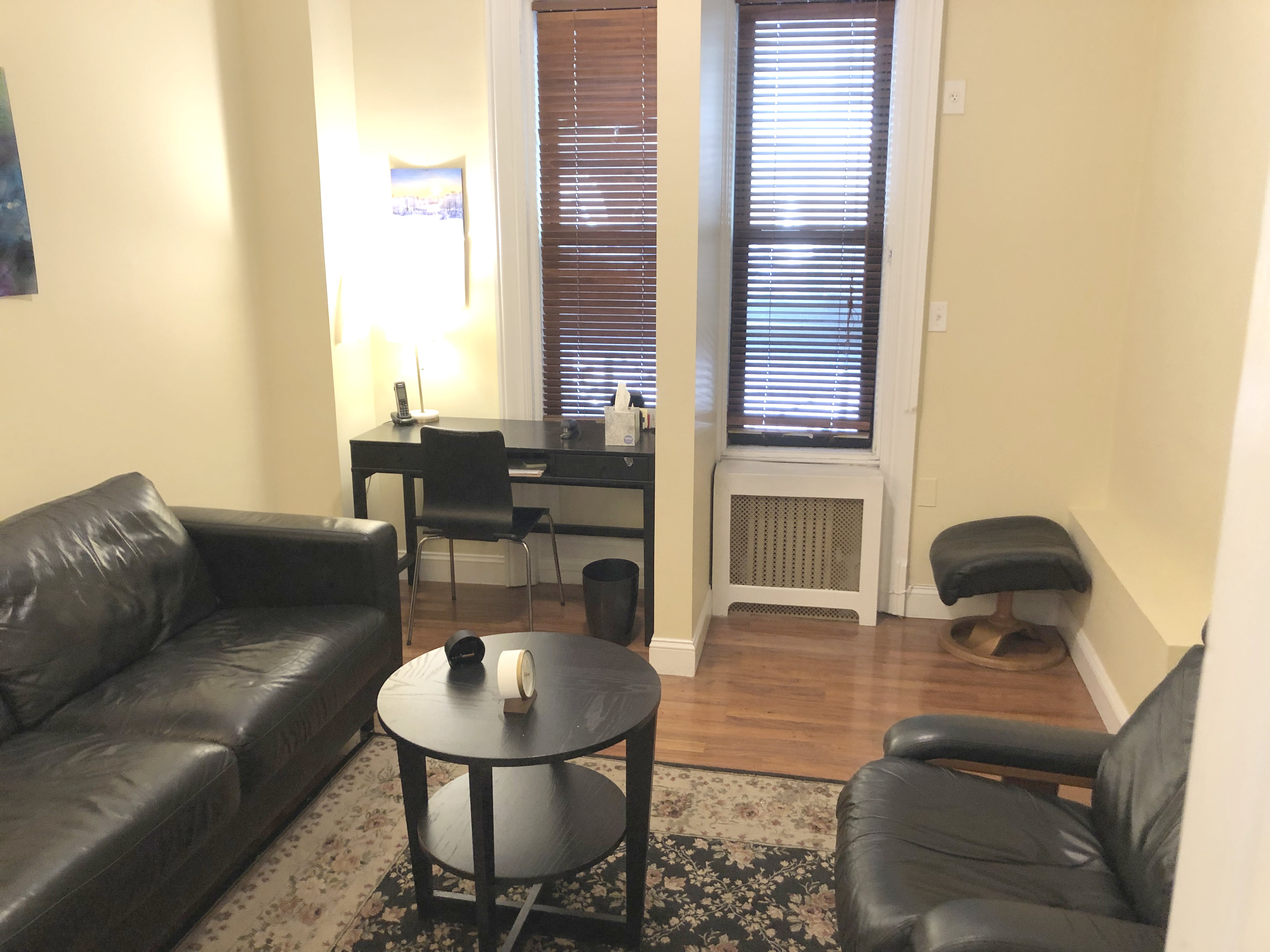 Office furniture including couch, chairs, and a desk