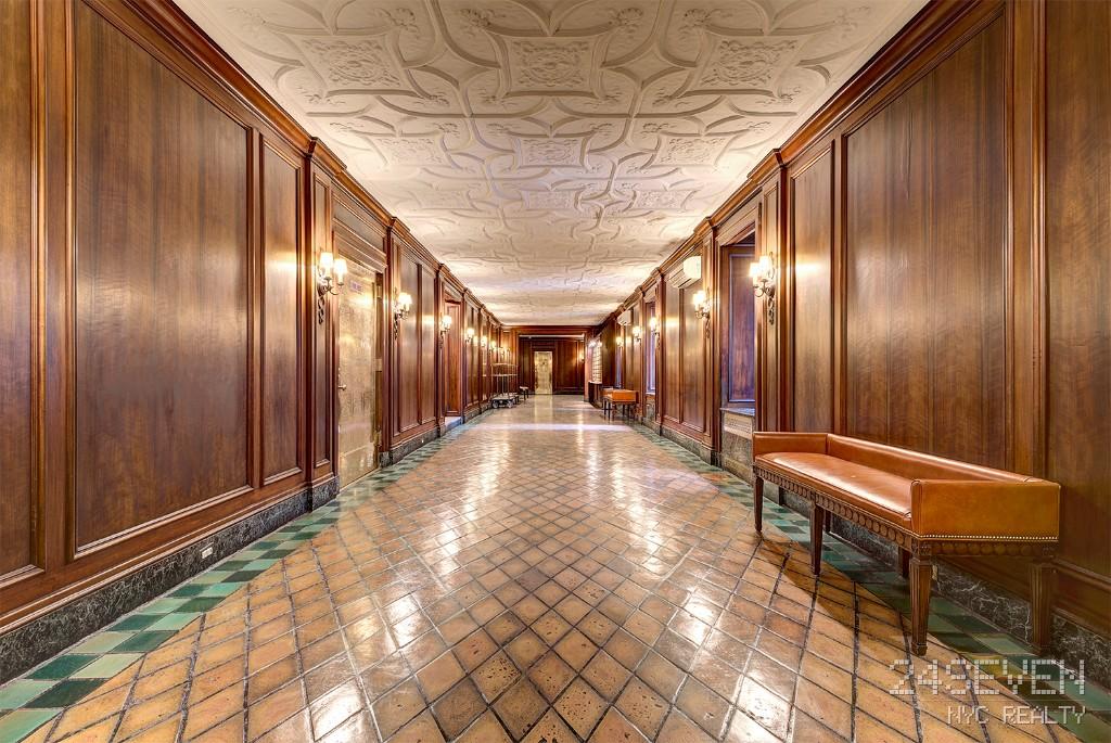 Well-lit corridor with modern interior design elements