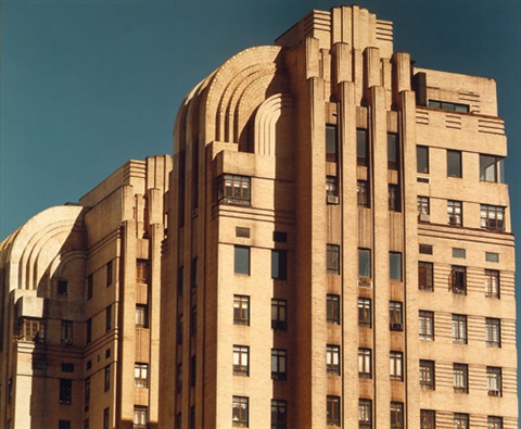 High-rise office building in urban setting with entrance