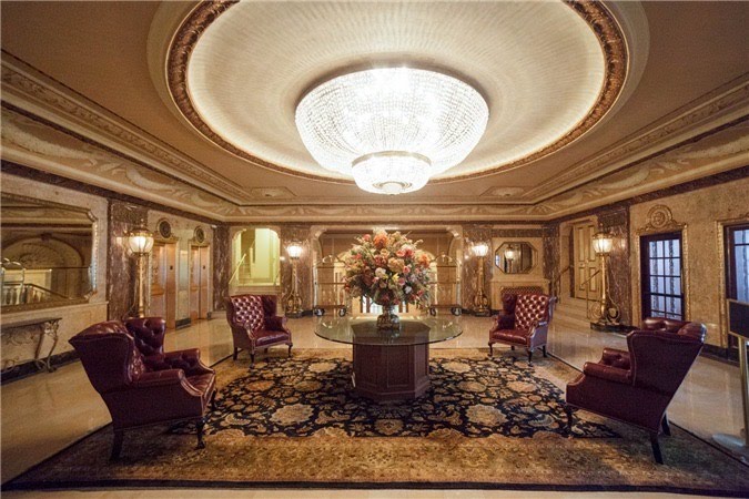 Reception room with chandelier, table, and chairs