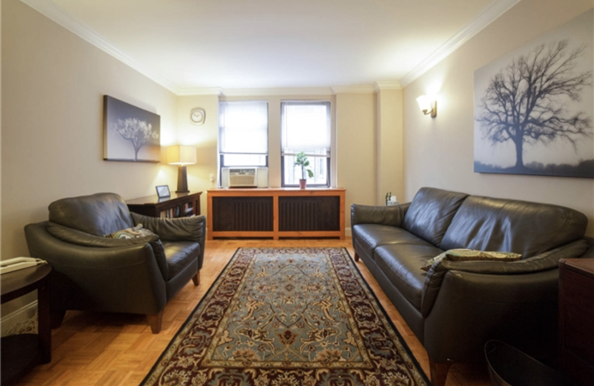 Comfortable living room area with couch and coffee table
