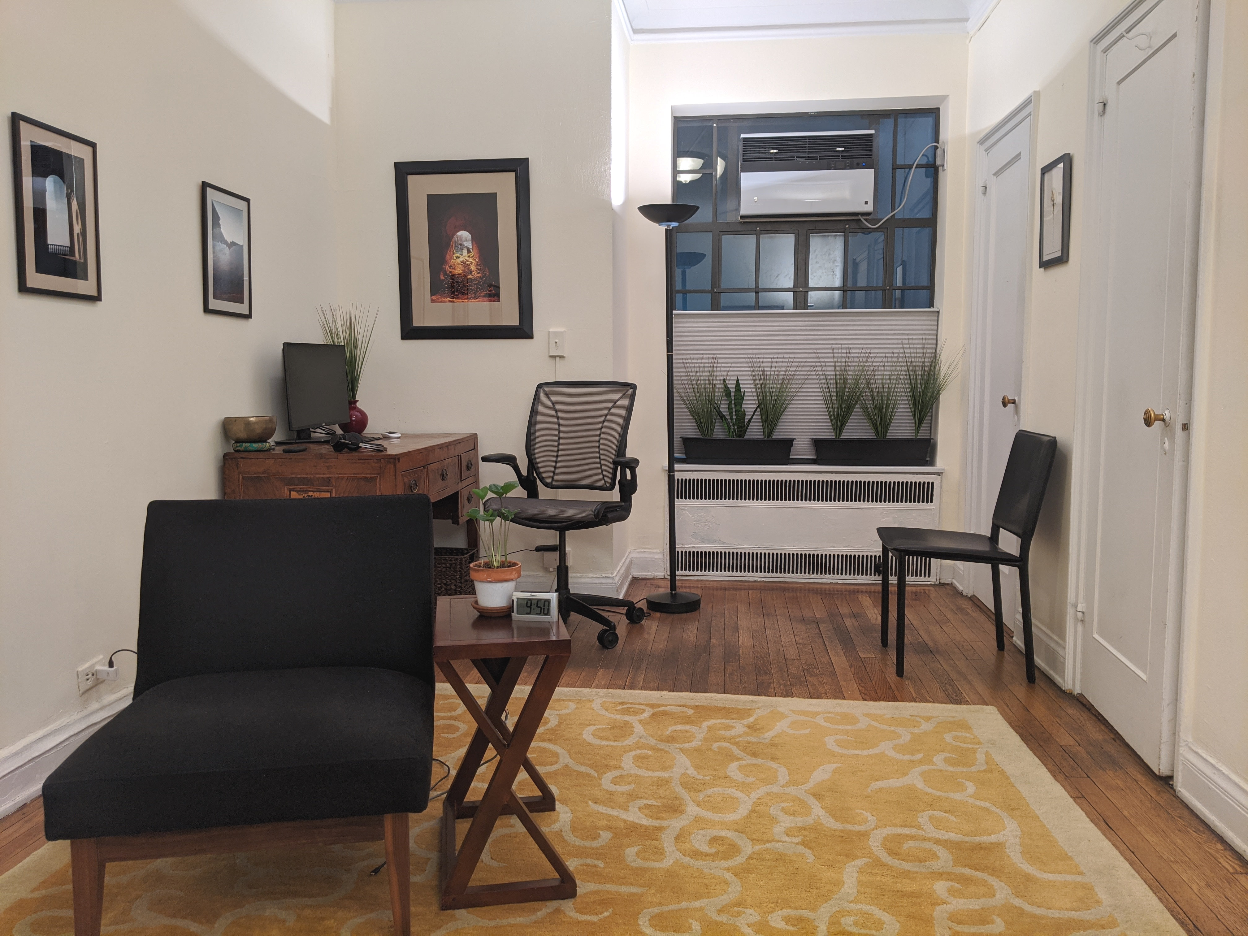 Interior office space with rug, chairs, and table