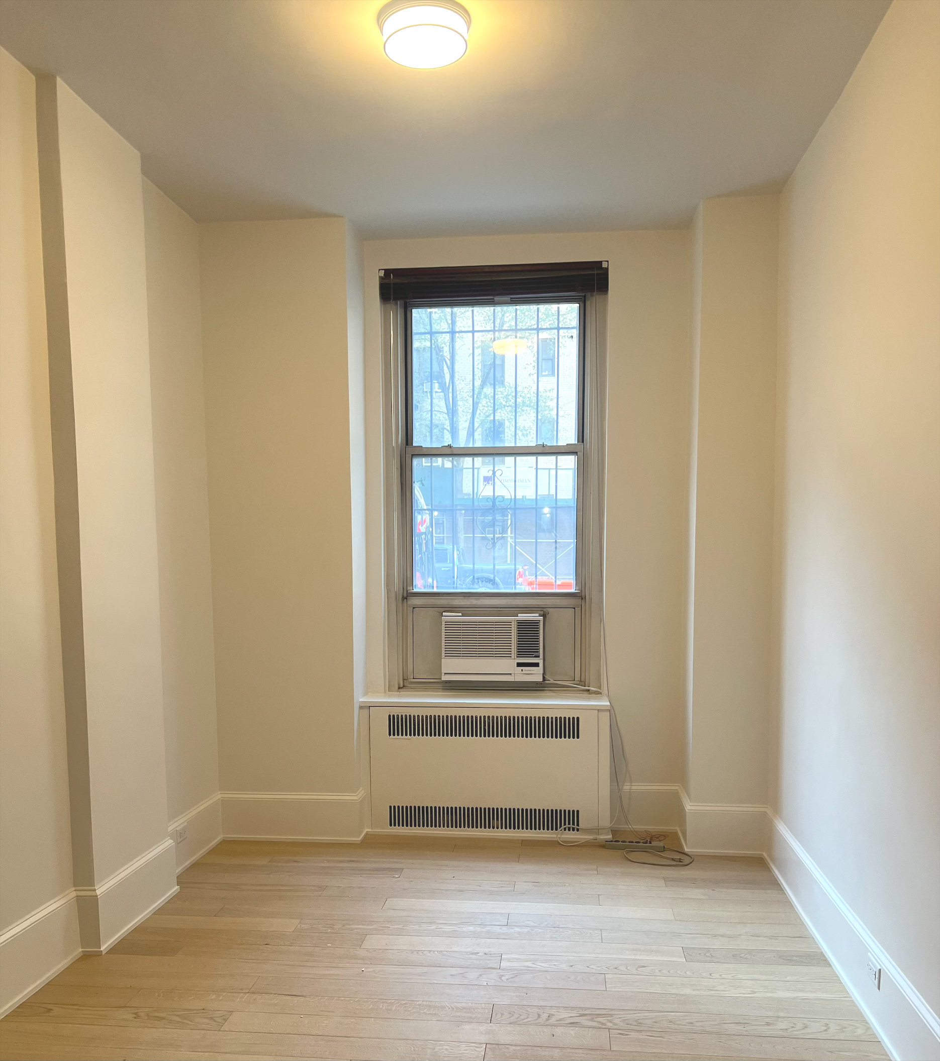 Interior office space featuring bay windows and hardwood flooring
