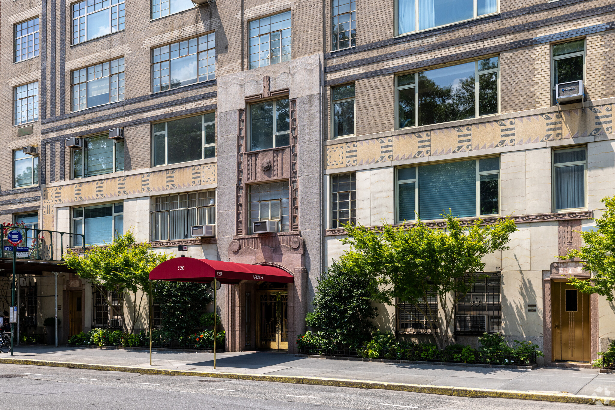 High-rise building exterior with street view and canopy