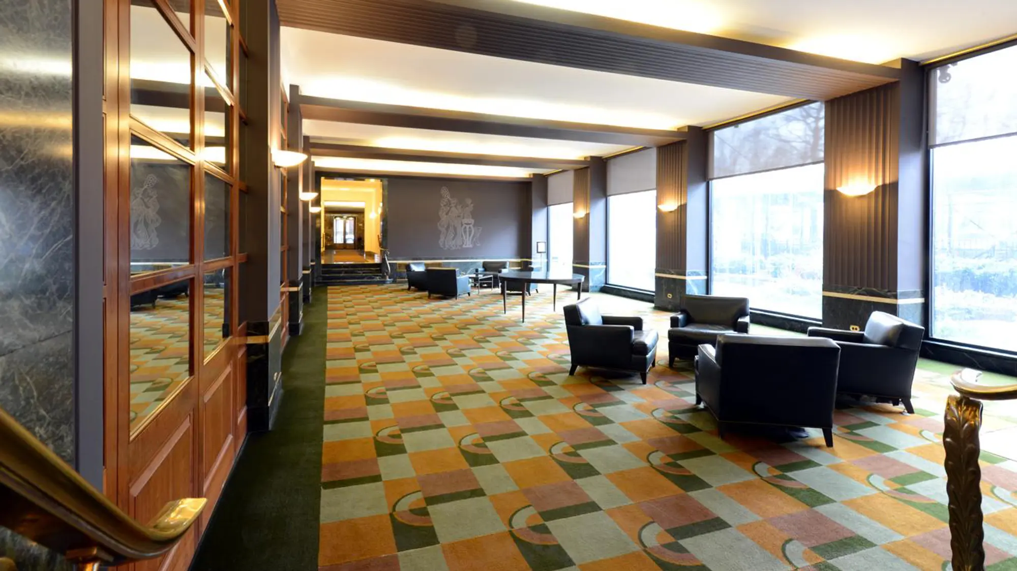 Bright office space with large windows and open layout