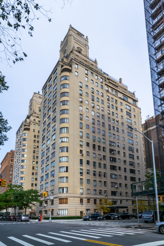 Urban office building with glass windows and car access